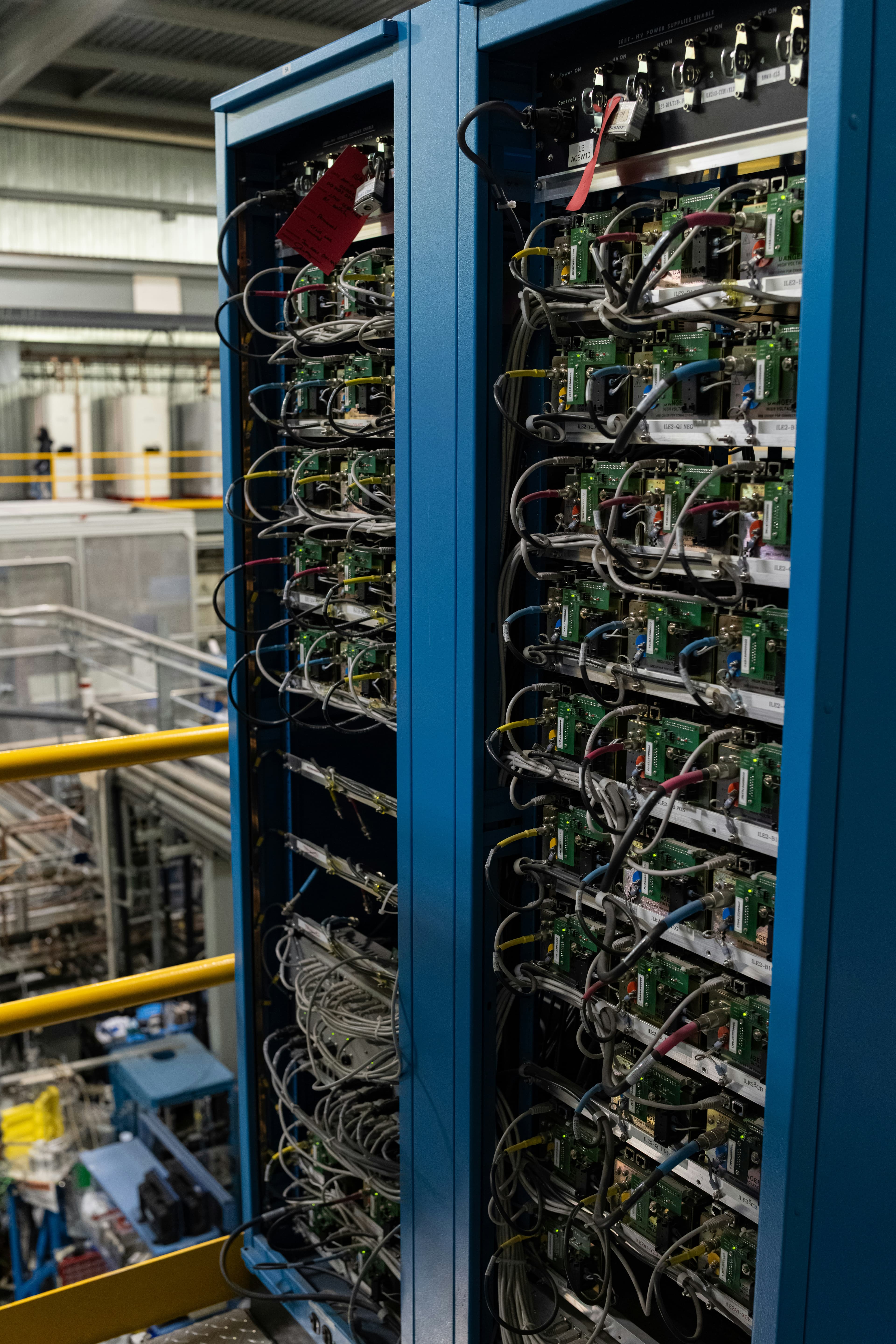 Two server racks filled with wiring and components, representing leader election across healthy nodes.